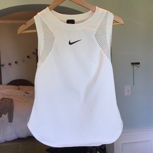 White Nike athletic top with mesh back and sides